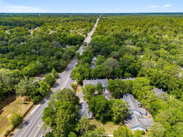 938 NW 42nd Ter, Gainesville, FL 32605 - aerial overview of property's location with a heavily wooded area and nearby suburban area