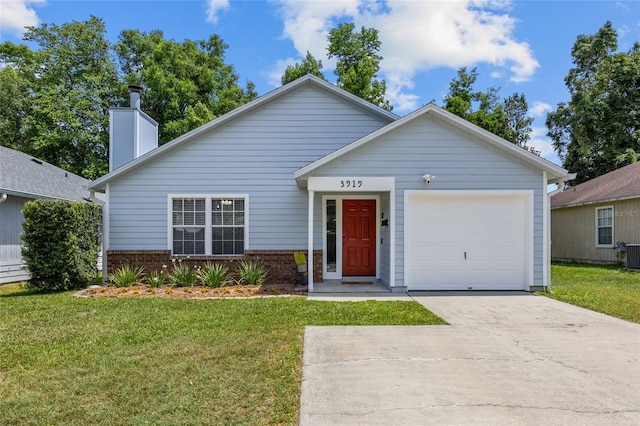single story home featuring concrete driveway, an attached garage, a front lawn, and brick siding