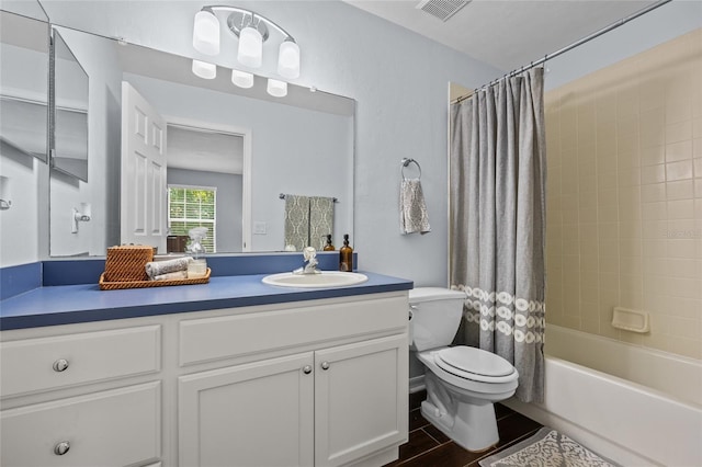 bathroom featuring toilet, visible vents, vanity, and shower / bathtub combination with curtain
