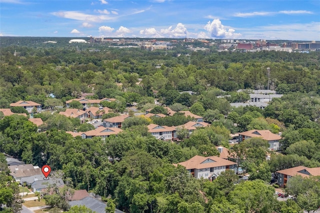 drone / aerial view featuring a wooded view