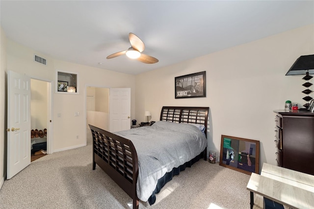carpeted bedroom featuring visible vents, baseboards, and a ceiling fan