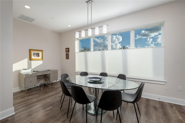 dining space with baseboards, recessed lighting, visible vents, and wood finished floors
