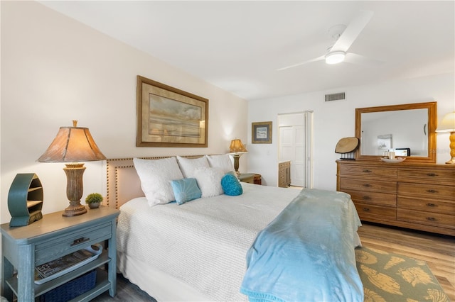 205 Pacifica Vista Way Unit 205, Saint Augustine, FL 32080 - bedroom with ceiling fan, connected bathroom, visible vents, and wood finished floors