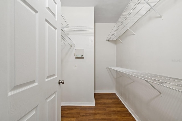 spacious closet with wood finished floors