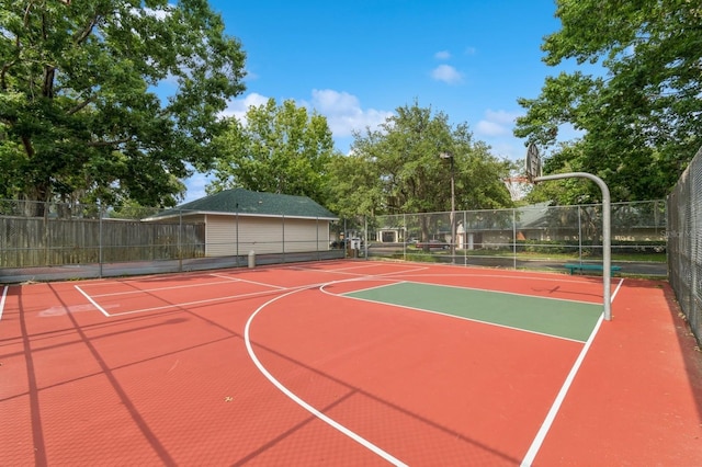 view of sport court featuring community basketball court and fence