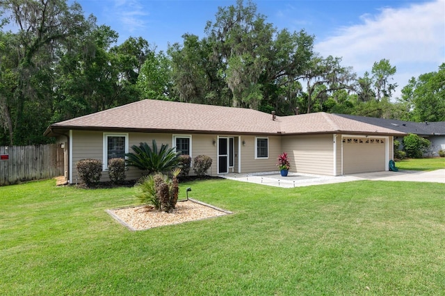 9505 NW 4th Pl, Gainesville, FL 32607 - single story home featuring fence, an attached garage, concrete driveway, and a front yard