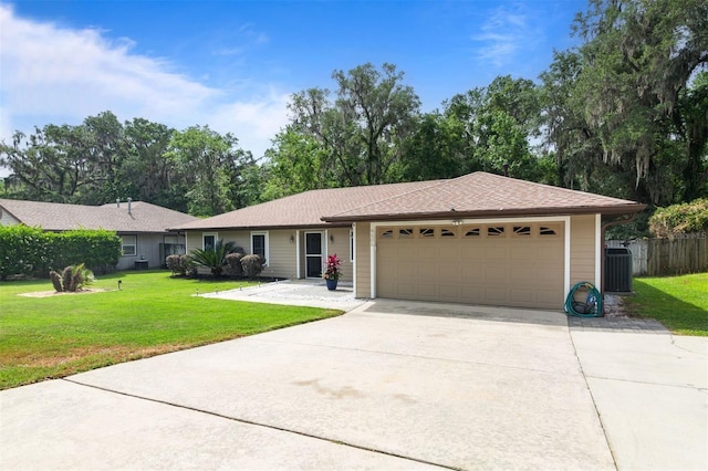 9505 NW 4th Pl, Gainesville, FL 32607 - ranch-style house featuring an attached garage, concrete driveway, central AC unit, and a front lawn