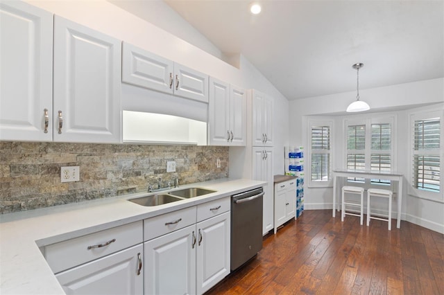 9505 NW 4th Pl, Gainesville, FL 32607 - kitchen featuring dishwasher, a sink, white cabinetry, vaulted ceiling, and tasteful backsplash