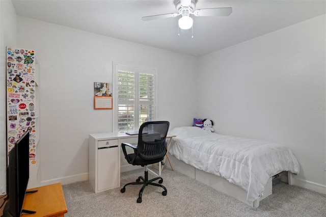 9505 NW 4th Pl, Gainesville, FL 32607 - bedroom with freestanding refrigerator, light carpet, ceiling fan, and baseboards