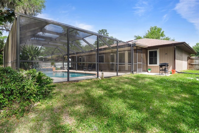 9505 NW 4th Pl, Gainesville, FL 32607 - rear view of property with a yard, fence, a patio, and an outdoor pool