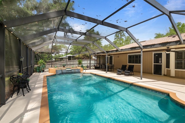 9505 NW 4th Pl, Gainesville, FL 32607 - view of swimming pool with a fenced backyard, a patio area, glass enclosure, and a pool with connected hot tub