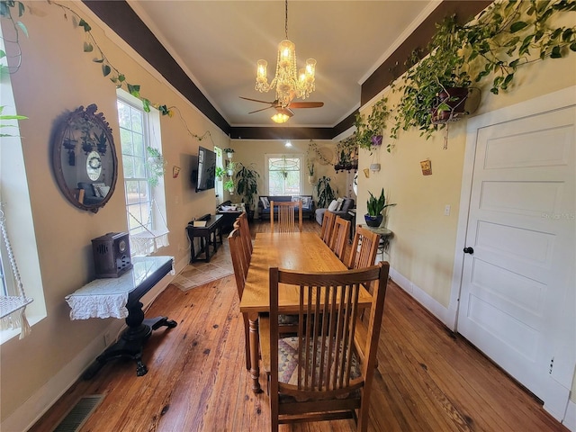 9150 SW 151st Ln, Archer, FL 32618 - dining space featuring a chandelier, ornamental molding, wood-type flooring, ceiling fan, and baseboards