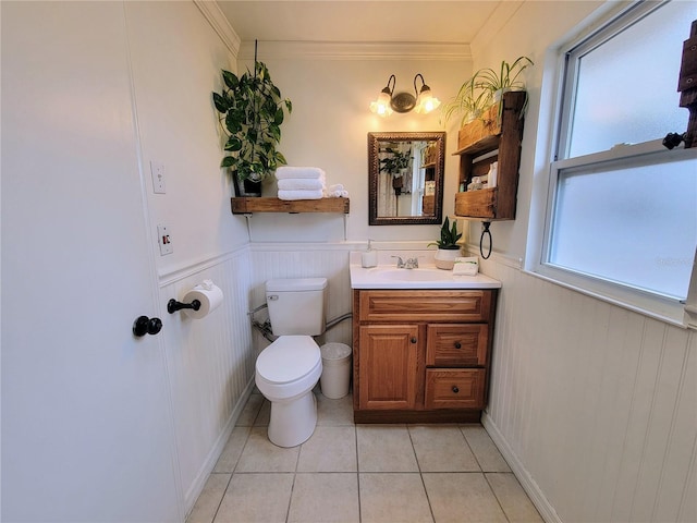 9150 SW 151st Ln, Archer, FL 32618 - bathroom featuring tile patterned floors, wainscoting, toilet, vanity, and crown molding