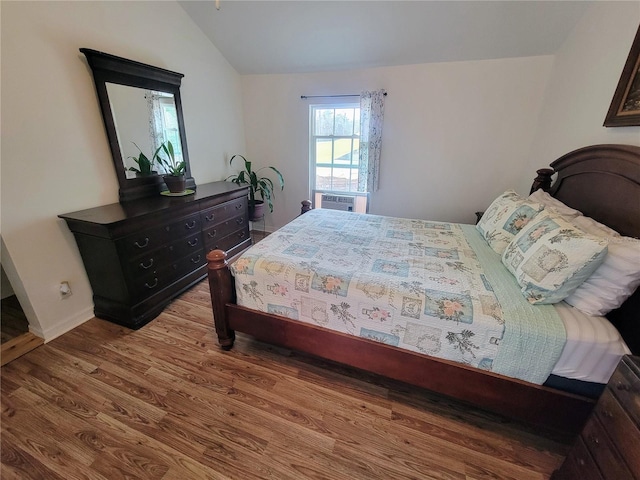 9150 SW 151st Ln, Archer, FL 32618 - bedroom with vaulted ceiling, wood finished floors, and cooling unit