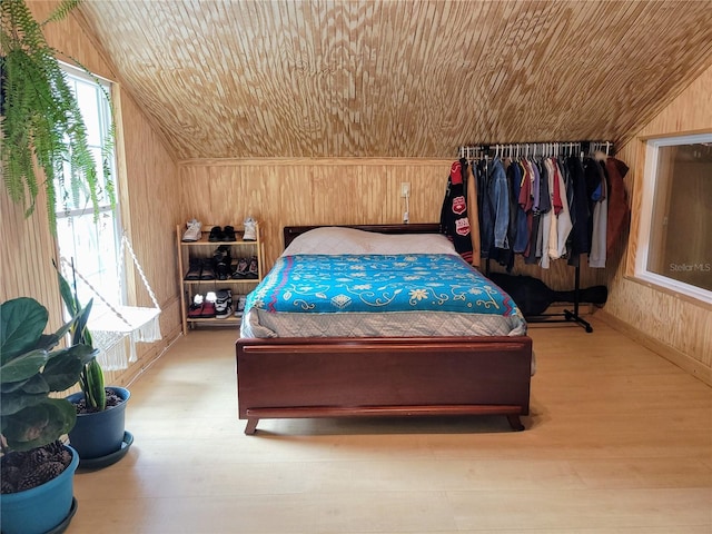 9150 SW 151st Ln, Archer, FL 32618 - bedroom featuring wood walls, wood finished floors, lofted ceiling, and wood ceiling