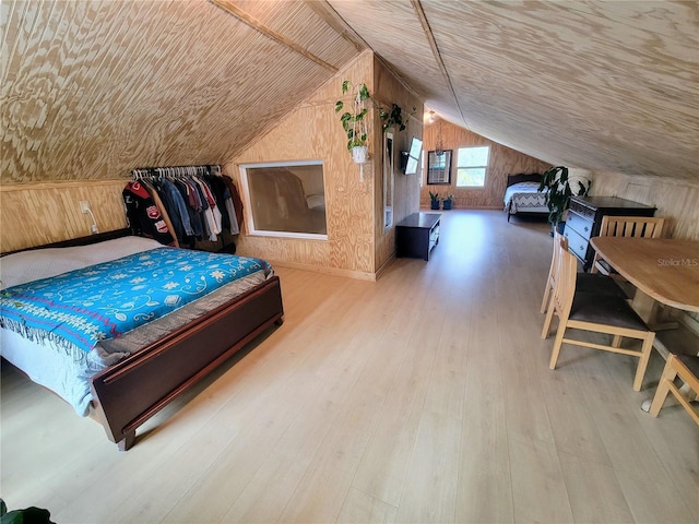 9150 SW 151st Ln, Archer, FL 32618 - bedroom featuring wood walls, vaulted ceiling, and wood finished floors