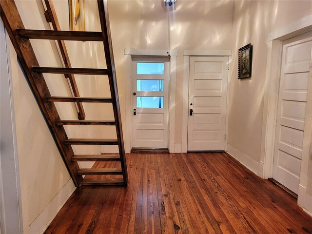 9150 SW 151st Ln, Archer, FL 32618 - entryway featuring dark wood-style flooring, stairway, and baseboards