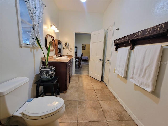 9150 SW 151st Ln, Archer, FL 32618 - bathroom featuring tile patterned flooring, toilet, and vanity