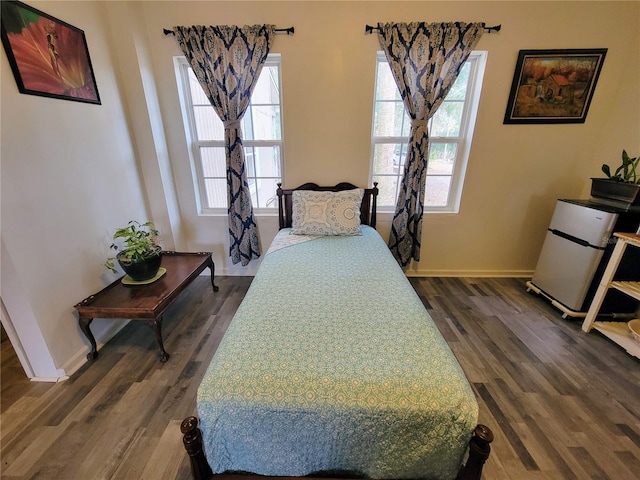 9150 SW 151st Ln, Archer, FL 32618 - bedroom with dark wood-style flooring and baseboards