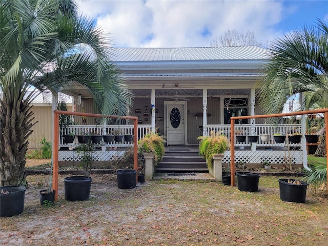 9150 SW 151st Ln, Archer, FL 32618 - entrance to property featuring a porch and metal roof