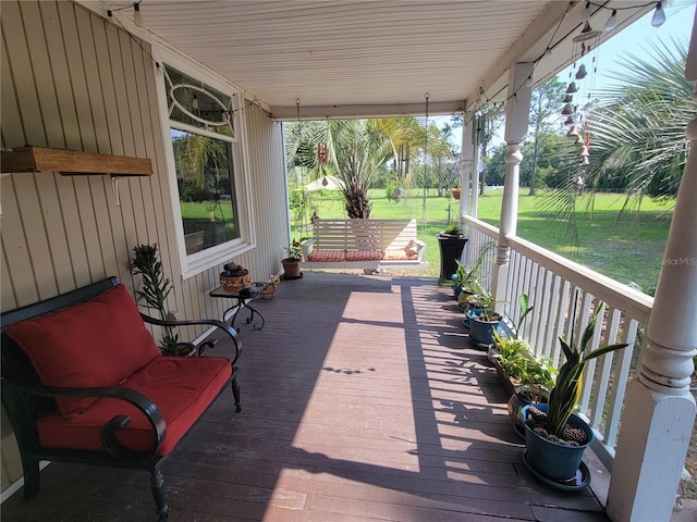 9150 SW 151st Ln, Archer, FL 32618 - wooden deck with a porch and a yard
