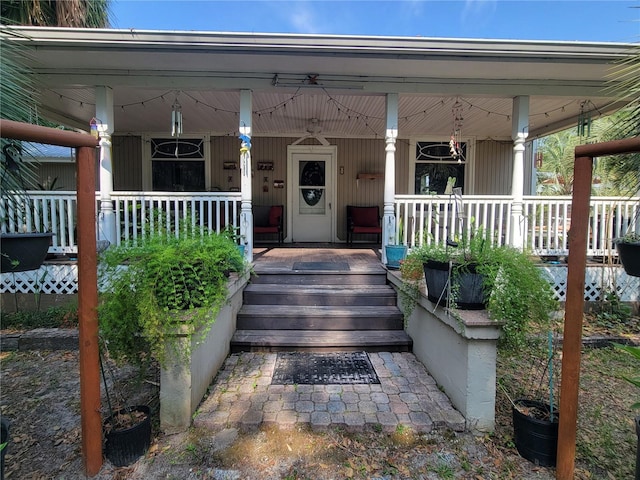 9150 SW 151st Ln, Archer, FL 32618 - doorway to property featuring covered porch