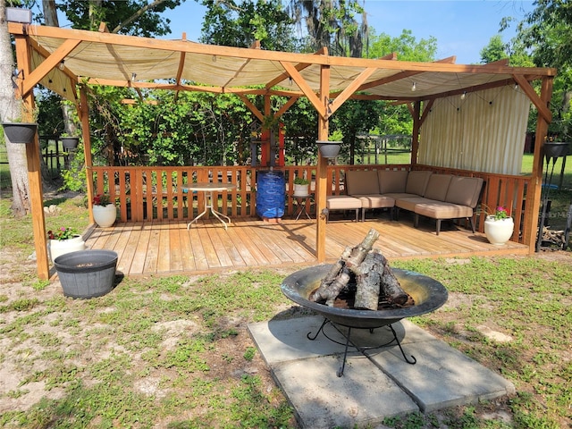 9150 SW 151st Ln, Archer, FL 32618 - wooden terrace with an outdoor fire pit