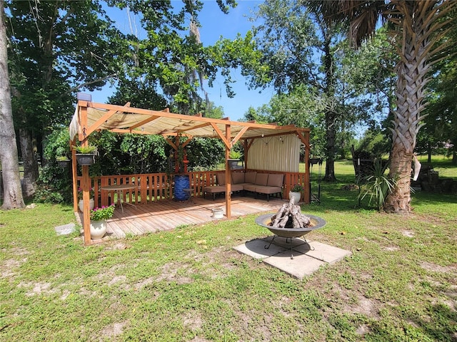 9150 SW 151st Ln, Archer, FL 32618 - view of grassy yard with a deck and an outdoor living space with a fire pit
