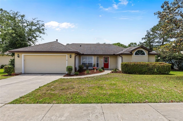 single story home with concrete driveway, a front yard, a shingled roof, and an attached garage
