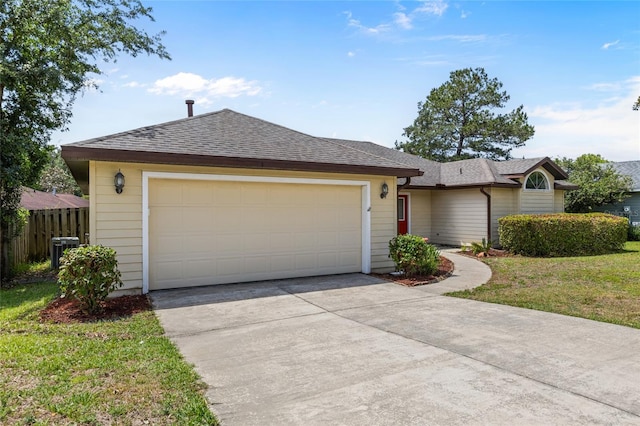 ranch-style home featuring fence, an attached garage, driveway, cooling unit, and a shingled roof