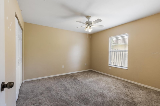 unfurnished bedroom featuring ceiling fan, carpet floors, baseboards, and a closet