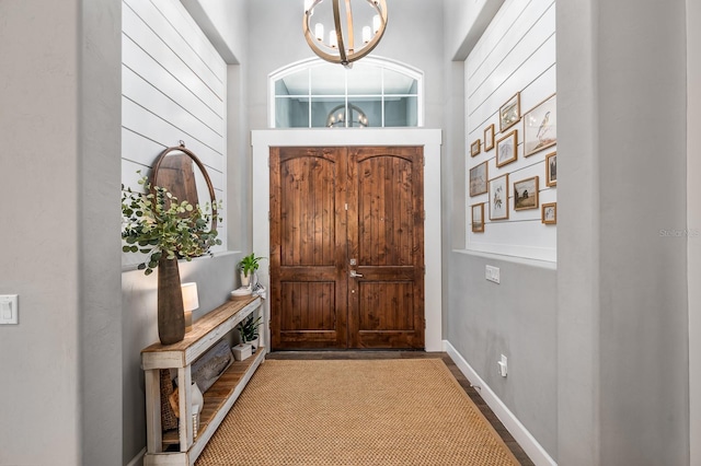 2734 SW 105th St, Gainesville, FL 32608 - foyer entrance featuring a chandelier and baseboards