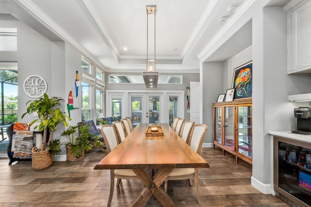 2734 SW 105th St, Gainesville, FL 32608 - dining space with beverage cooler, dark wood finished floors, french doors, a tray ceiling, and plenty of natural light