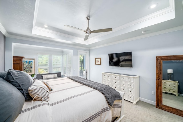 2734 SW 105th St, Gainesville, FL 32608 - bedroom featuring light colored carpet, a raised ceiling, crown molding, access to exterior, and ceiling fan