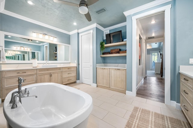 2734 SW 105th St, Gainesville, FL 32608 - full bath with ceiling fan, ornamental molding, a freestanding bath, vanity, and tile patterned flooring
