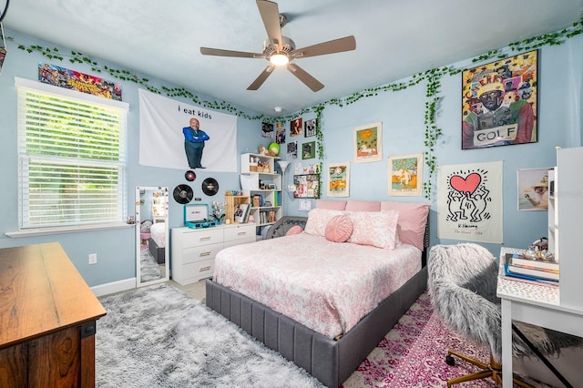 2734 SW 105th St, Gainesville, FL 32608 - bedroom with baseboards, carpet floors, and a ceiling fan