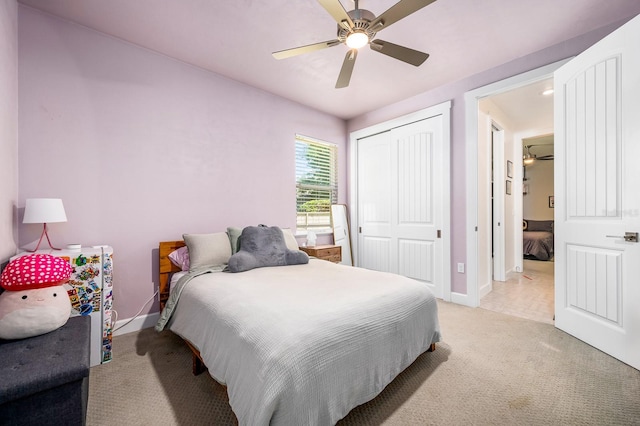 2734 SW 105th St, Gainesville, FL 32608 - bedroom featuring baseboards, light carpet, a closet, and a ceiling fan