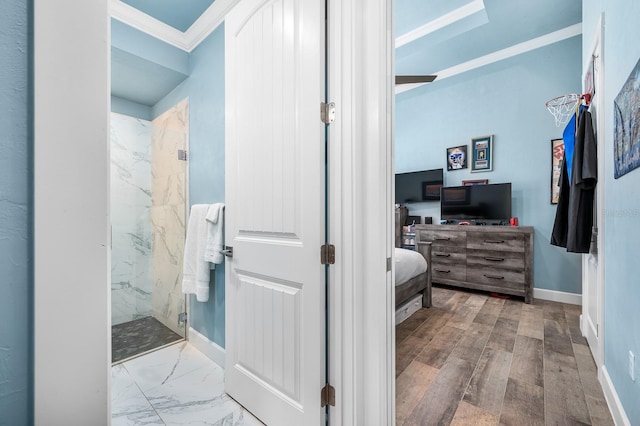 2734 SW 105th St, Gainesville, FL 32608 - ensuite bathroom featuring a marble finish shower, crown molding, baseboards, and marble finish floors