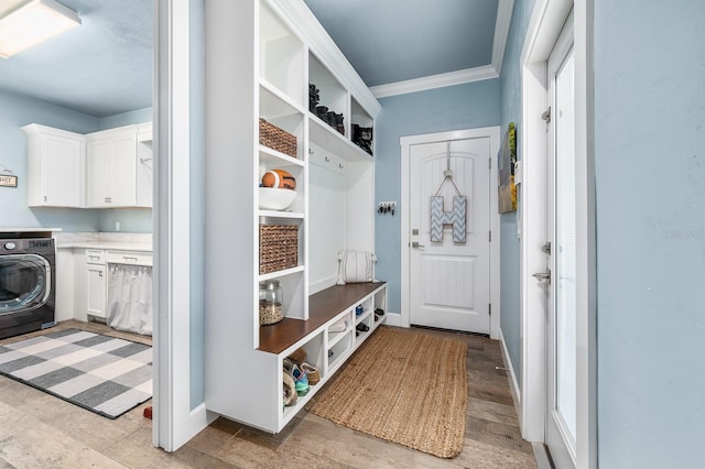 2734 SW 105th St, Gainesville, FL 32608 - mudroom featuring washer / dryer, ornamental molding, light wood-style floors, and baseboards