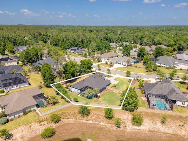 2734 SW 105th St, Gainesville, FL 32608 - aerial view of residential area with property boundaries highlighted, a heavily wooded area, and a pool