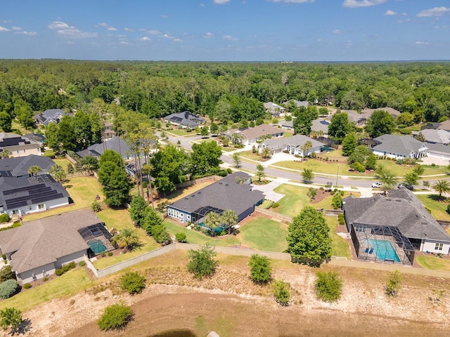 2734 SW 105th St, Gainesville, FL 32608 - aerial perspective of suburban area featuring a heavily wooded area and a pool area