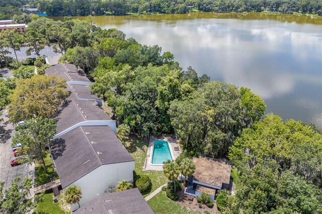 bird's eye view of a nearby body of water and a pool
