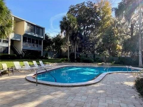 2514 SW 14th Dr, Gainesville, FL 32608 - community pool with a patio and stairway