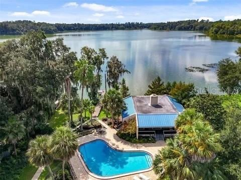 2514 SW 14th Dr, Gainesville, FL 32608 - view of subject property with a pool area and a nearby body of water