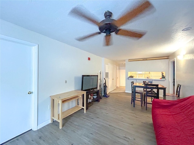 4000 SW 23rd St Unit 3-107, Gainesville, FL 32608 - living room with wood finished floors and ceiling fan