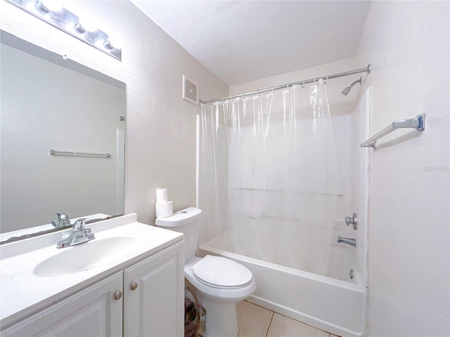 4000 SW 23rd St Unit 3-107, Gainesville, FL 32608 - full bath featuring tile patterned floors, vanity, toilet, shower / tub combo, and a textured wall