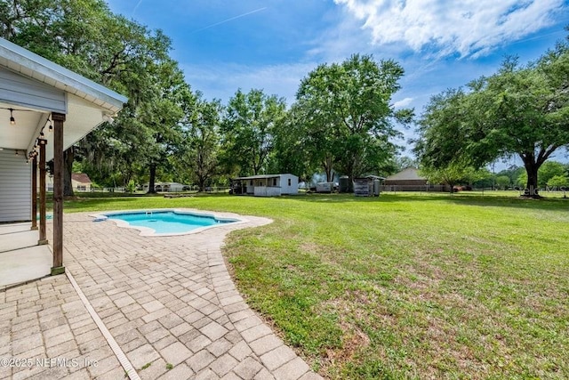 11802 SW 83rd Dr, Lake Butler, FL 32054 - outdoor pool featuring a patio area and a lawn