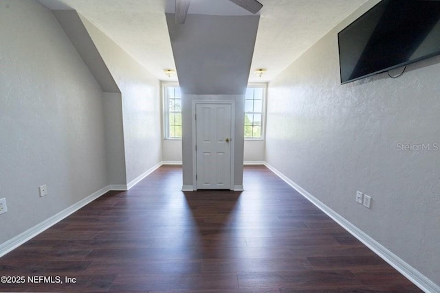 11802 SW 83rd Dr, Lake Butler, FL 32054 - bonus room featuring baseboards, dark wood-type flooring, and a textured wall