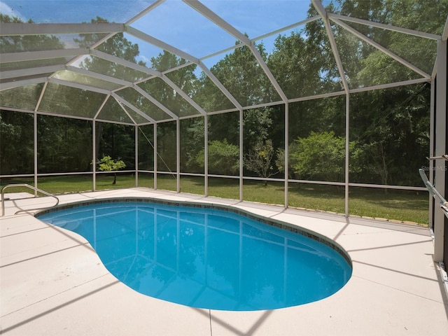 10712 SW 12th Ter, Micanopy, FL 32667 - swimming pool with a patio, a lawn, and glass enclosure