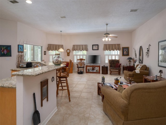 10712 SW 12th Ter, Micanopy, FL 32667 - living area featuring a ceiling fan, light tile patterned flooring, and recessed lighting